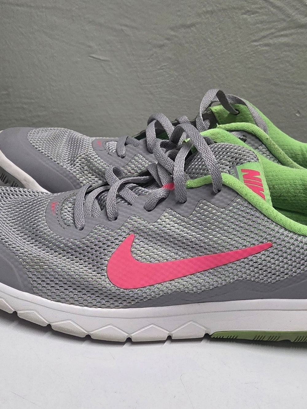 Nike Women's Gray Athletic Sneakers with Pink Swoosh